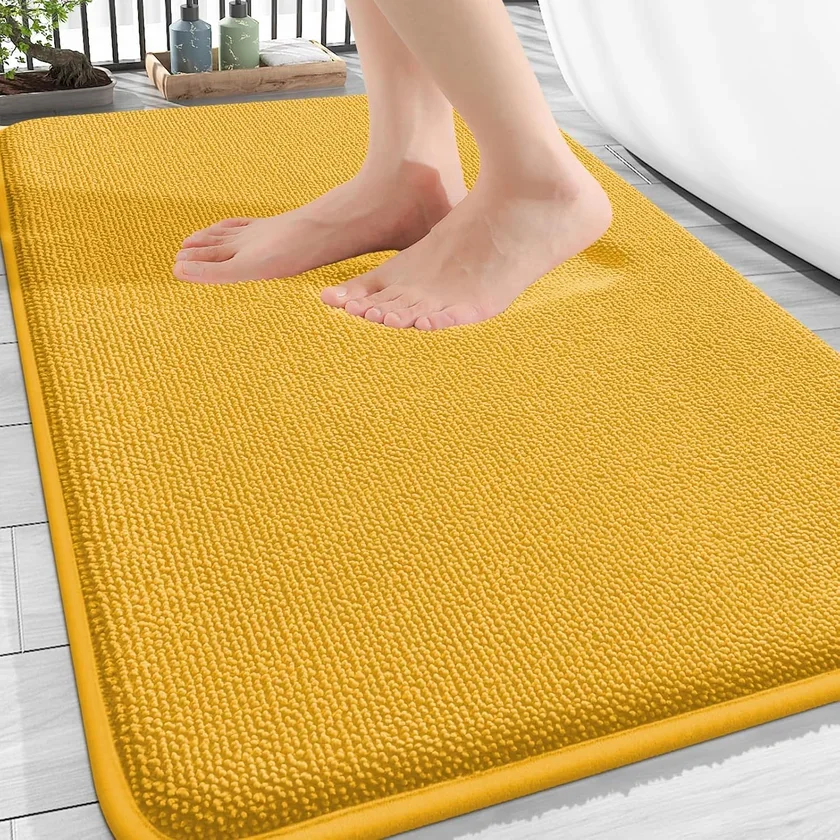 Side-by-side comparison of a memory foam bath rug and a chenille bath rug